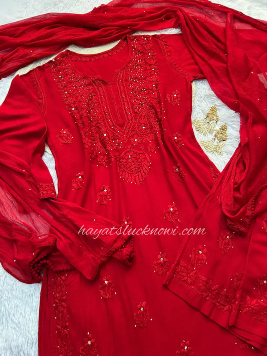Red rayon mukesh chikankari suit set by Hayat’s Lucknowi