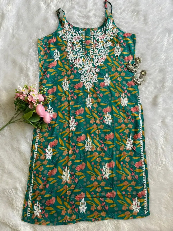 Saaz Green Noodle Strap Mul Mul Kurta featuring delicate Chikankari embroidery on lightweight, soft and breathable Mul Mul cotton fabric for an elegant and effortless ethnic look by Hayat’s Lucknowi.