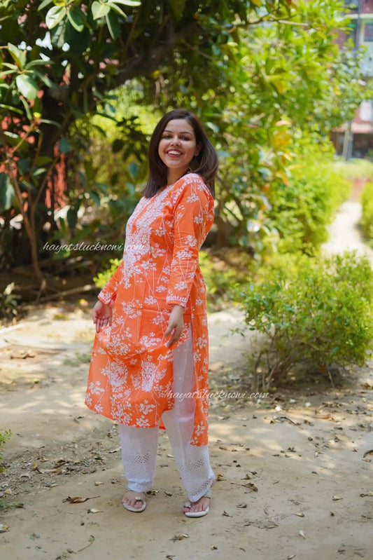 orange mul mul chikankari kurti with floral pattern