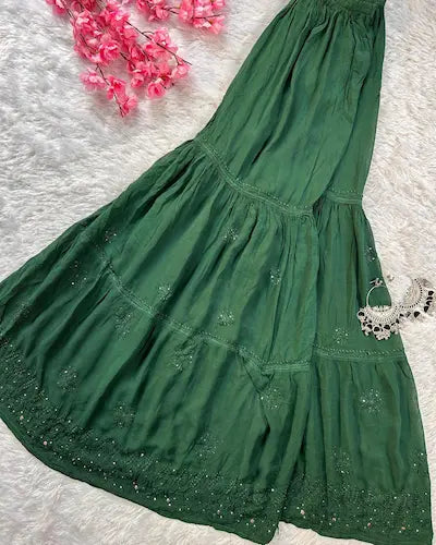 Bottle green georgette gharara set with chikankari and mukesh embroidery by Hayat’s Lucknowi