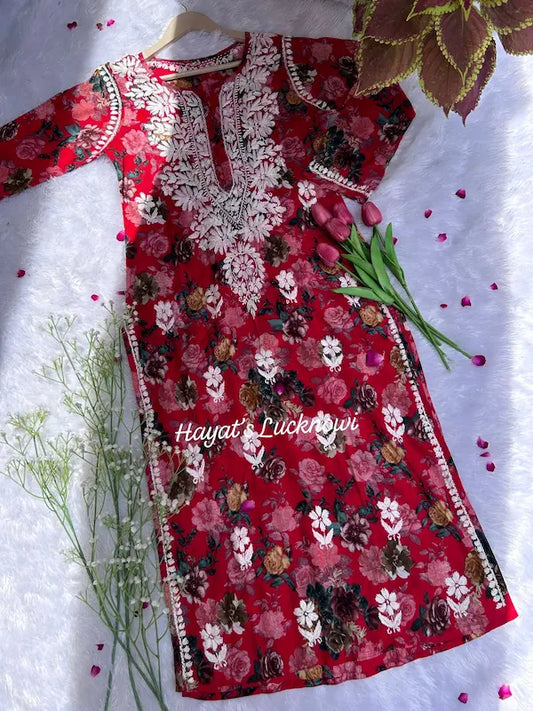 Red mul mul kurta with chikankari embroidery by Hayat’s Lucknowi