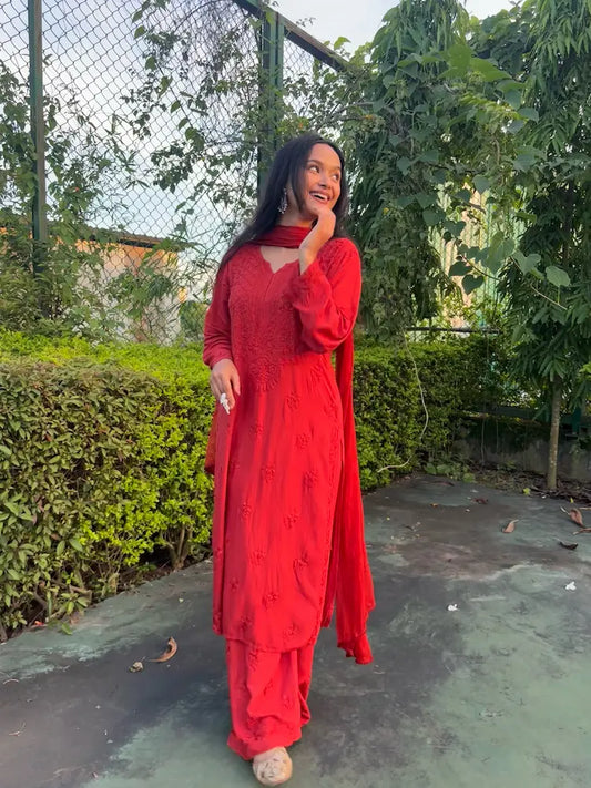 women wearing rust brown chikankari red suit set with three piece stitched suit with chiffon dupatta