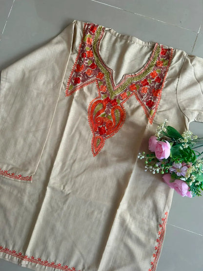 
Aaira soft beige cotton Kashmiri short embroidered kurti featuring intricate traditional Kashmiri embroidery and soft breathable cotton fabric for elegant everyday ethnic wear by Hayat's Lucknowi.
