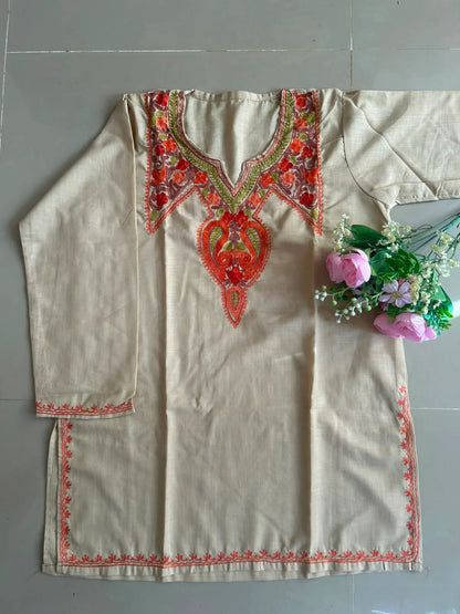 
Aaira soft beige cotton Kashmiri short embroidered kurti featuring intricate traditional Kashmiri embroidery and soft breathable cotton fabric for elegant everyday ethnic wear by Hayat's Lucknowi.
