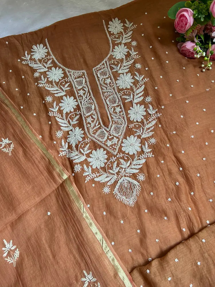 
Amber women's brown mul Chanderi handwork kurta and dupatta unstitched suit featuring intricate handcrafted detailing and elegant traditional styling for timeless ethnic wear by Hayat's Lucknowi.
