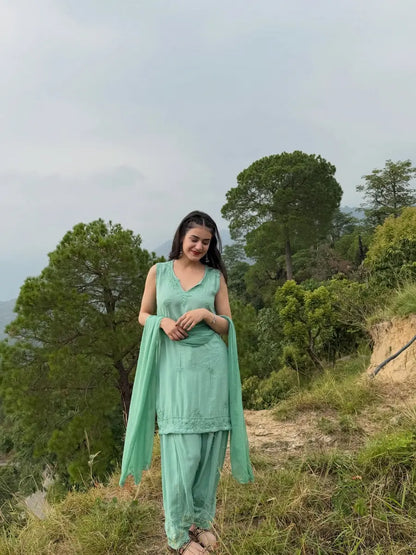 Aqua green sleeveless rayon Chikankari Farshi set featuring intricate handcrafted Chikankari embroidery on soft, flowy rayon fabric with a graceful traditional Farshi silhouette for elegant festive and ethnic wear by Hayat's Lucknowi.
