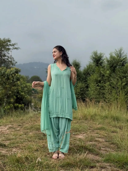 Aqua green sleeveless rayon Chikankari Farshi set featuring intricate handcrafted Chikankari embroidery on soft, flowy rayon fabric with a graceful traditional Farshi silhouette for elegant festive and ethnic wear by Hayat's Lucknowi.
