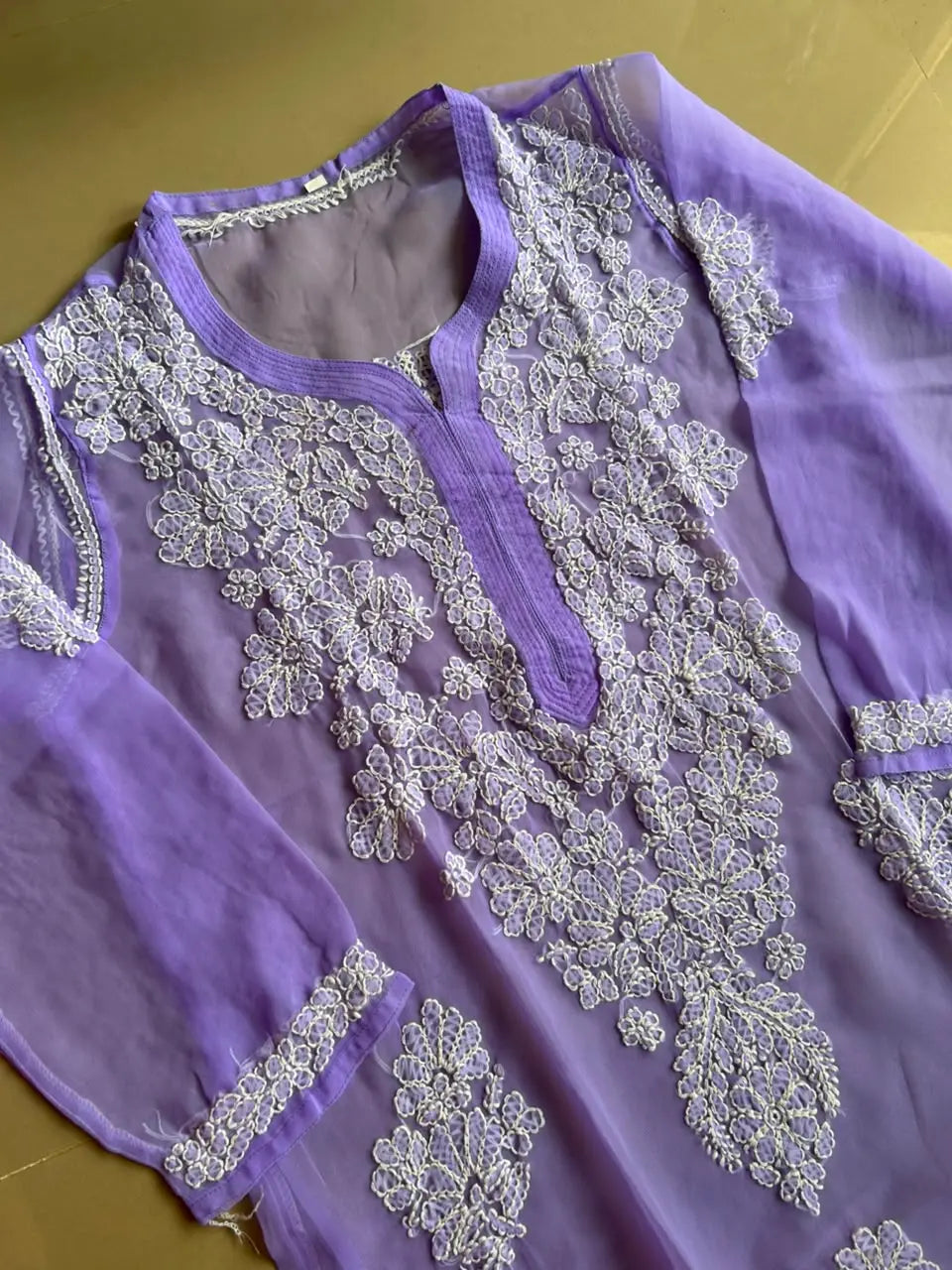 Ayena Lavender Georgette Chikankari Kurti featuring intricate hand embroidery on lightweight georgette fabric for an elegant festive and ethnic look by Hayat’s Lucknowi.
