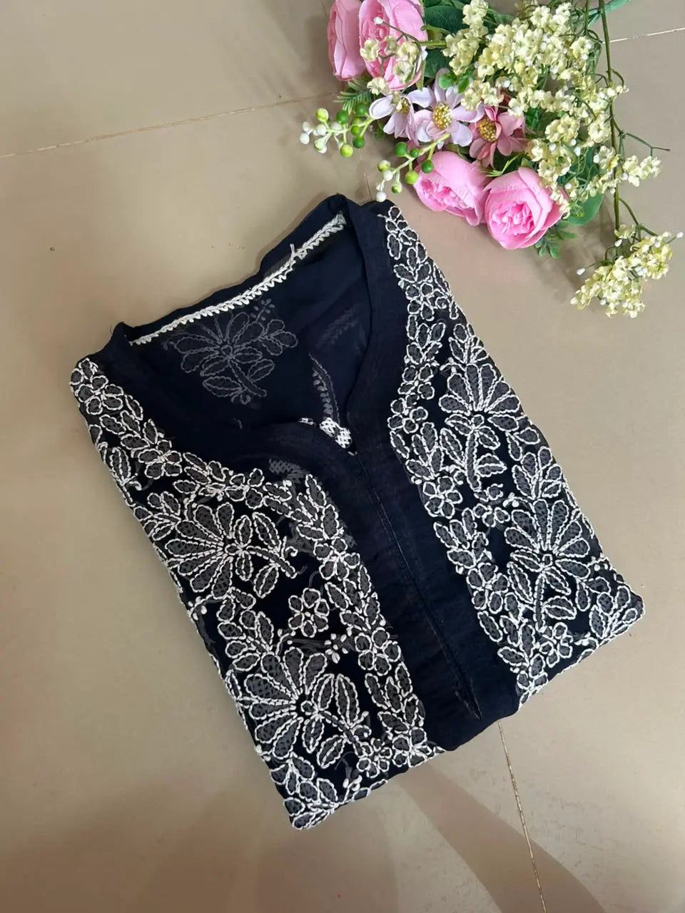 Ayena Navy Blue Georgette Chikankari Kurti featuring intricate hand embroidery on lightweight georgette fabric for an elegant festive and ethnic look by Hayat’s Lucknowi.

