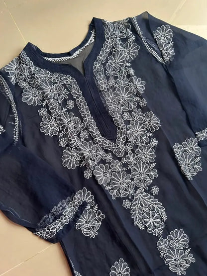 Ayena Navy Blue Georgette Chikankari Kurti featuring intricate hand embroidery on lightweight georgette fabric for an elegant festive and ethnic look by Hayat’s Lucknowi.

