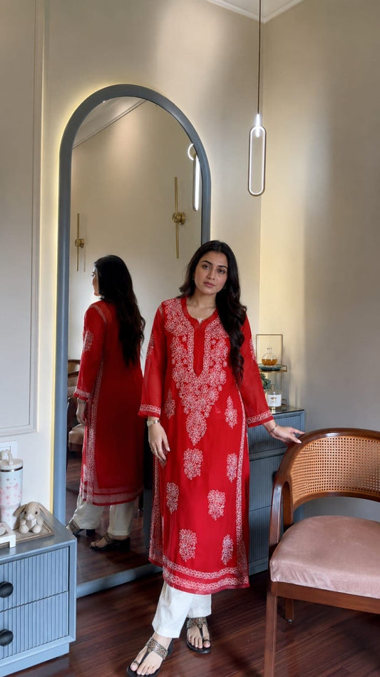 

Ayena Red Georgette Chikankari Kurti featuring intricate hand embroidery on lightweight georgette fabric for an elegant festive and ethnic look by Hayat’s Lucknowi.
