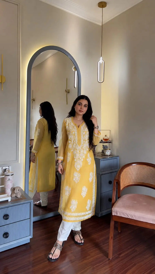Ayena Yellow Georgette Chikankari Kurti featuring intricate hand embroidery on lightweight georgette fabric for an elegant festive and ethnic look by Hayat’s Lucknowi.

