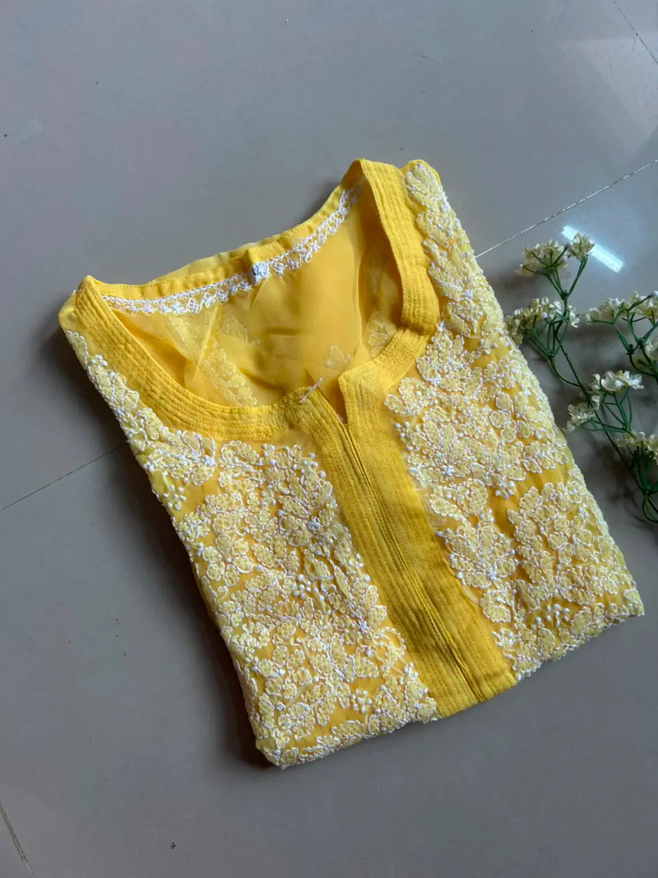 Ayena Yellow Georgette Chikankari Kurti featuring intricate hand embroidery on lightweight georgette fabric for an elegant festive and ethnic look by Hayat’s Lucknowi.
