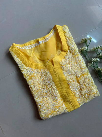 Ayena Yellow Georgette Chikankari Kurti featuring intricate hand embroidery on lightweight georgette fabric for an elegant festive and ethnic look by Hayat’s Lucknowi.
