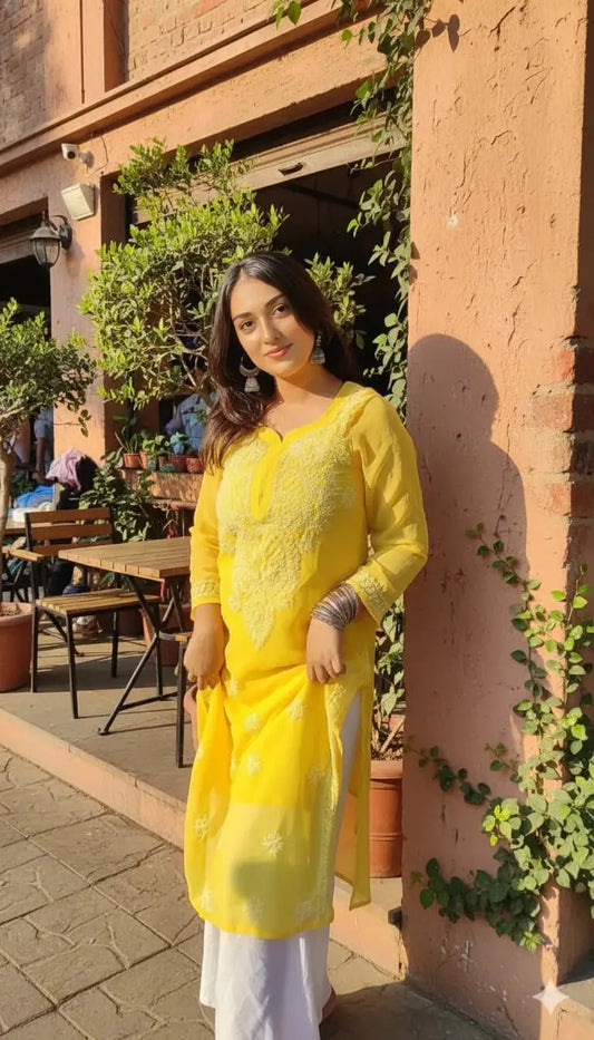 Ayena Yellow Georgette Chikankari Kurti featuring intricate hand embroidery on lightweight georgette fabric for an elegant festive and ethnic look by Hayat’s Lucknowi.
