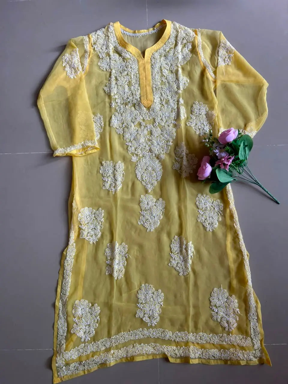 Ayena Yellow Georgette Chikankari Kurti featuring intricate hand embroidery on lightweight georgette fabric for an elegant festive and ethnic look by Hayat’s Lucknowi.
