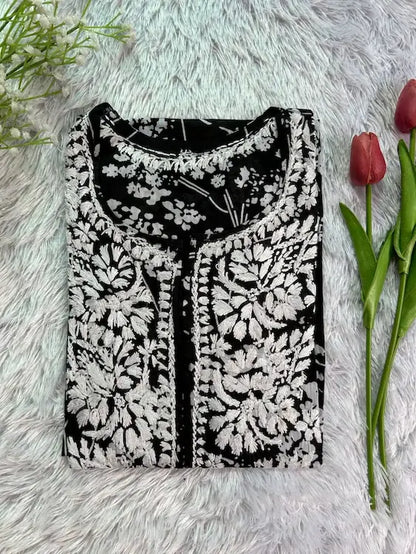 
Batool black mul mul chikankari kurta featuring delicate hand embroidery and soft breathable fabric for elegant, timeless everyday ethnic wear by Hayat's Lucknowi.
