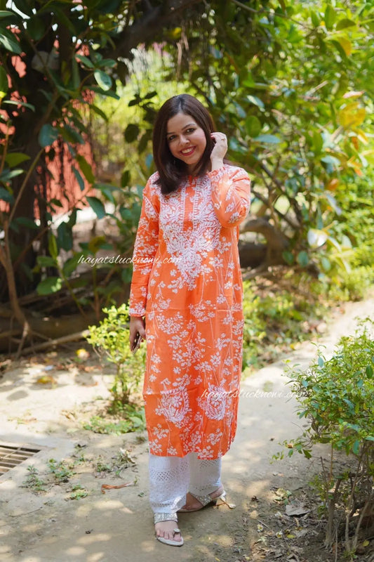
Batool orange mul mul chikankari kurta featuring delicate hand embroidery and soft breathable fabric for vibrant everyday ethnic wear by Hayat's Lucknowi.
