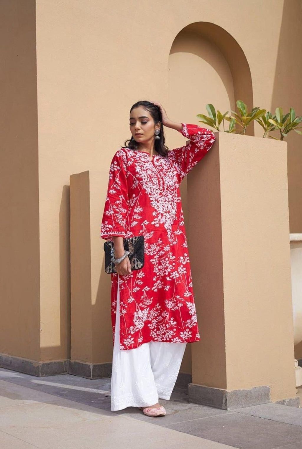 

Batool red Mul Mul Lucknowi Chikankari kurta featuring intricate handcrafted Chikankari embroidery on soft, lightweight, and breathable Mul Mul cotton fabric for elegant everyday and festive ethnic wear by Hayat's Lucknowi.
