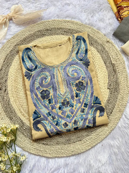 
Beige blue color work Kashmiri long kurta featuring intricate traditional embroidery-inspired detailing and elegant handcrafted craftsmanship for timeless ethnic wear by Hayat's Lucknowi.
