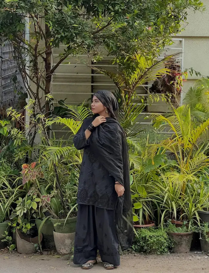 Black Chikankari Farshi Shalwar Suit featuring intricate traditional hand embroidery for a graceful and elegant ethnic look by Hayat’s Lucknowi.
