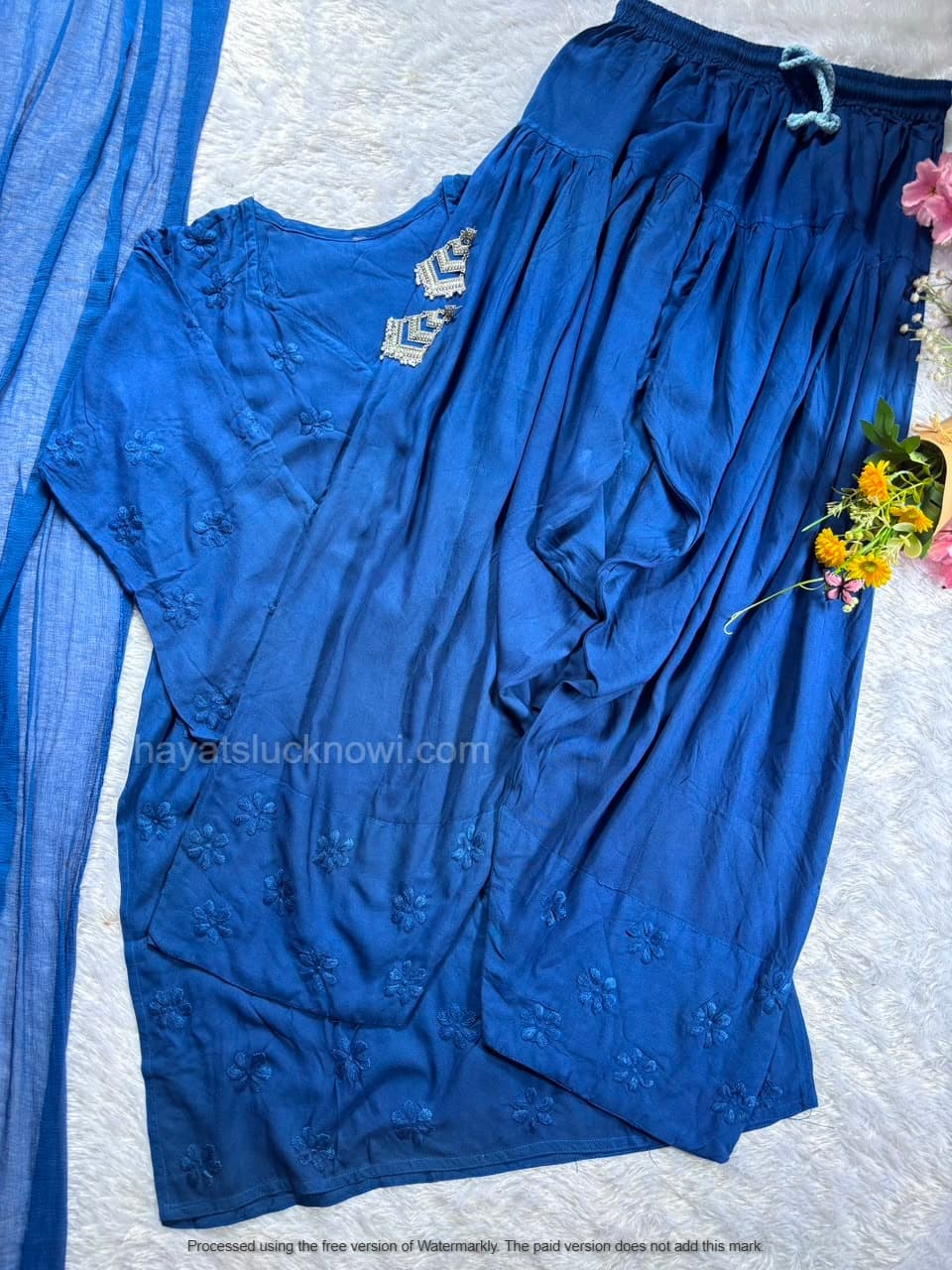 
Blue Rayon Chikankari Farshi Set featuring intricate hand embroidery on soft rayon fabric for a graceful traditional and festive look by Hayat’s Lucknowi.
