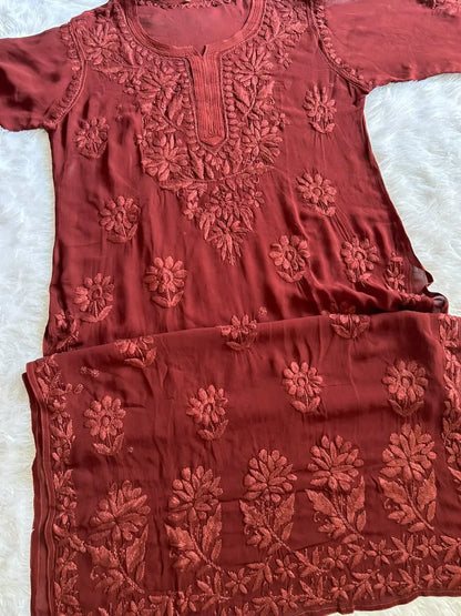 Zoya Brown Georgette Chikankari Kurta Set with Dupatta featuring intricate hand embroidery on lightweight georgette fabric for an elegant festive and ethnic look by Hayat’s Lucknowi.
