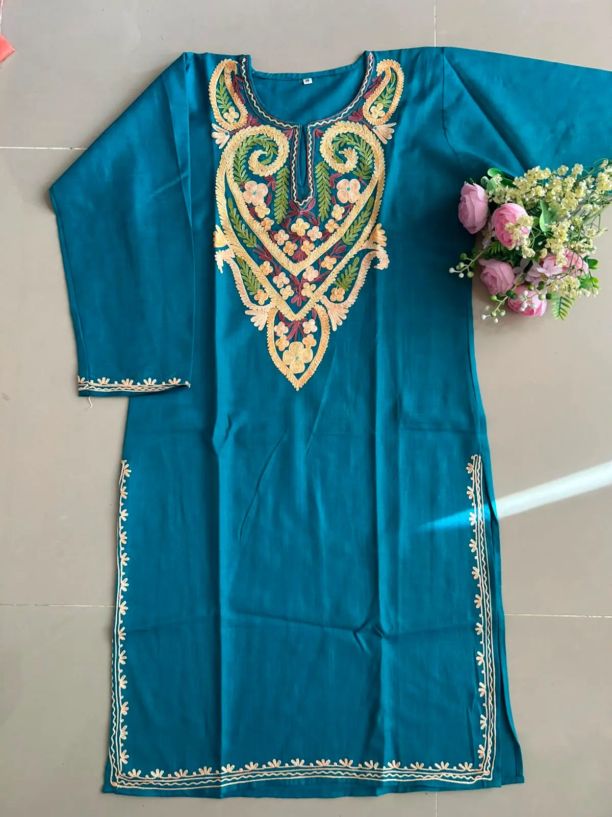 
Frozi blue cotton Kashmiri mid-length embroidered kurta featuring intricate traditional Kashmiri embroidery and soft breathable cotton fabric for elegant everyday ethnic wear by Hayat's Lucknowi.
