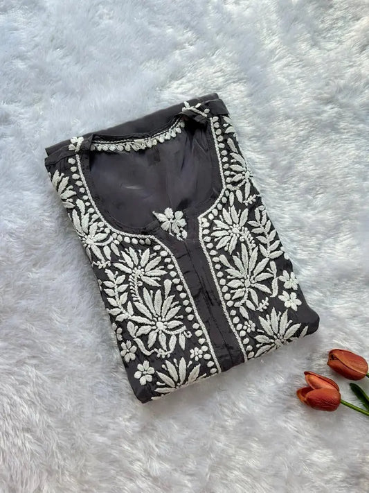 
Gray crepe silk chikankari kurta featuring delicate hand embroidery for a graceful and elegant ethnic look by Hayat's Lucknowi
