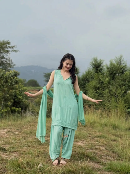 Aqua green sleeveless rayon Chikankari Farshi set featuring intricate handcrafted Chikankari embroidery on soft, flowy rayon fabric with a graceful traditional Farshi silhouette for elegant festive and ethnic wear by Hayat's Lucknowi.

