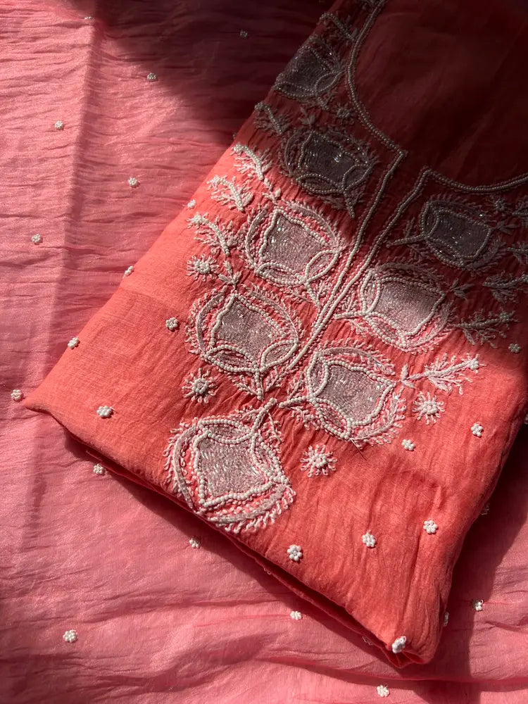 
Gul women's peach mul Chanderi handwork kurta and dupatta unstitched suit featuring intricate handcrafted detailing and elegant traditional craftsmanship for graceful festive and ethnic wear by Hayat's Lucknowi.

