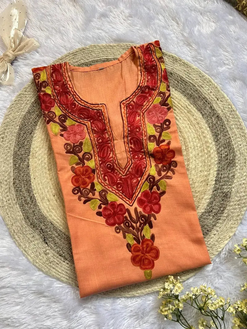 Peach Kashmiri short kurta with  red floral embroidery by Hayat’s Lucknowi