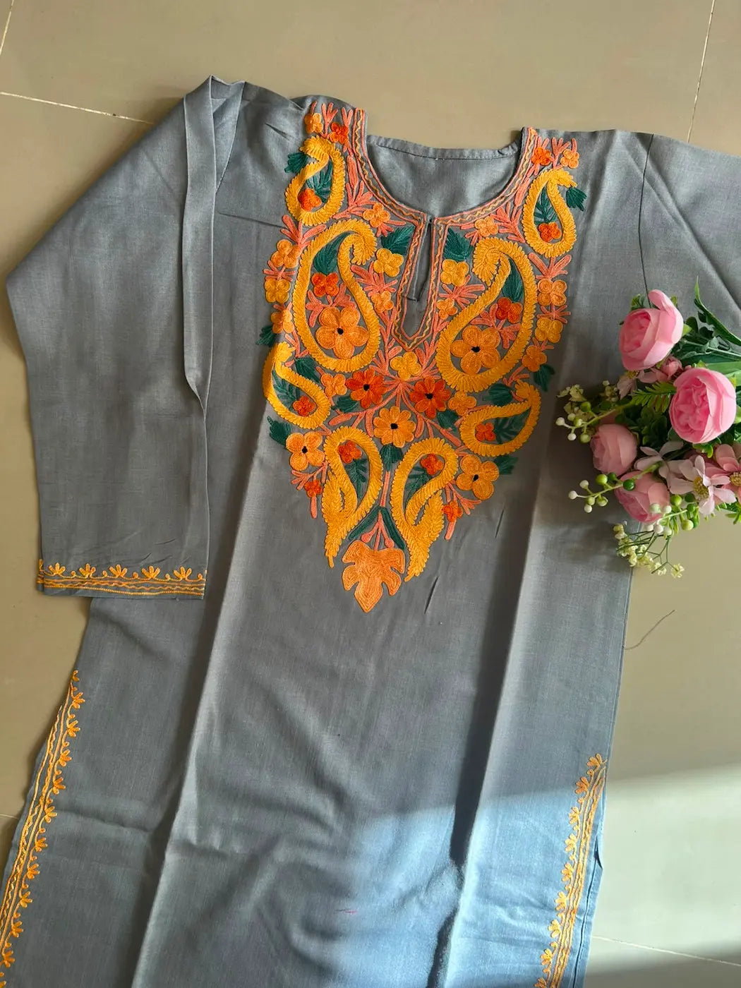 
Husna gray cotton Kashmiri mid-length embroidered kurta featuring intricate traditional Kashmiri embroidery and soft breathable cotton fabric for elegant everyday ethnic wear by Hayat's Lucknowi.
