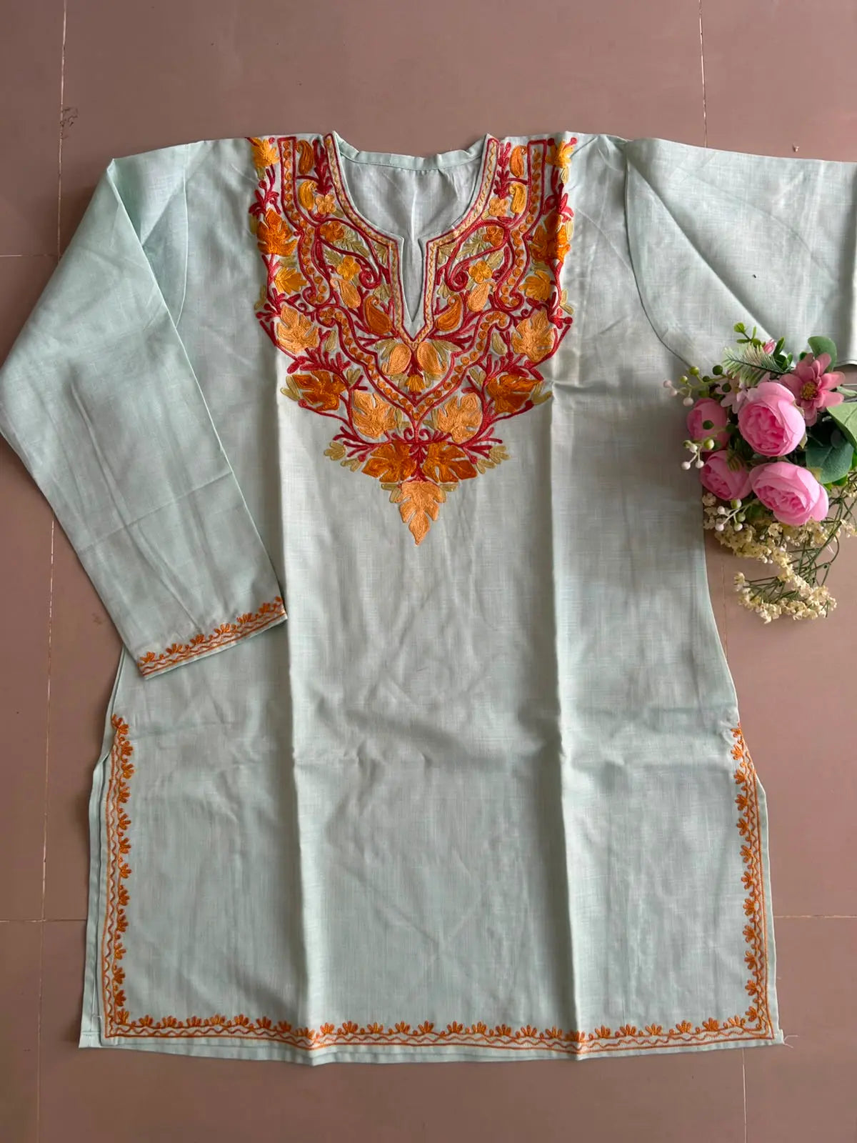 
Icy mint cotton Kashmiri short embroidered kurti featuring intricate traditional Kashmiri embroidery and soft breathable cotton fabric for cool, fresh everyday ethnic wear by Hayat's Lucknowi.
