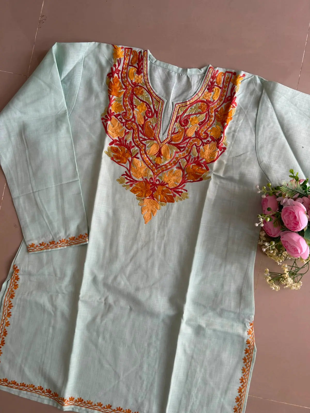 
Icy mint cotton Kashmiri short embroidered kurti featuring intricate traditional Kashmiri embroidery and soft breathable cotton fabric for cool, fresh everyday ethnic wear by Hayat's Lucknowi.
