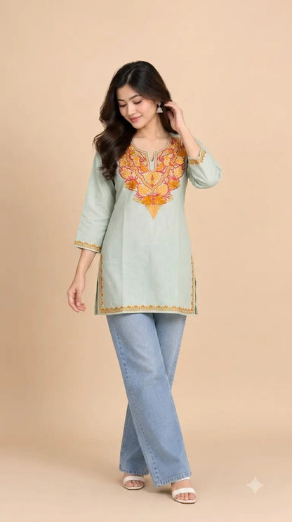 Icy Mint Cotton Kashmiri Short Embroidered Kurti featuring intricate traditional Kashmiri embroidery on soft, breathable cotton fabric for an elegant everyday ethnic look by Hayat’s Lucknowi.
