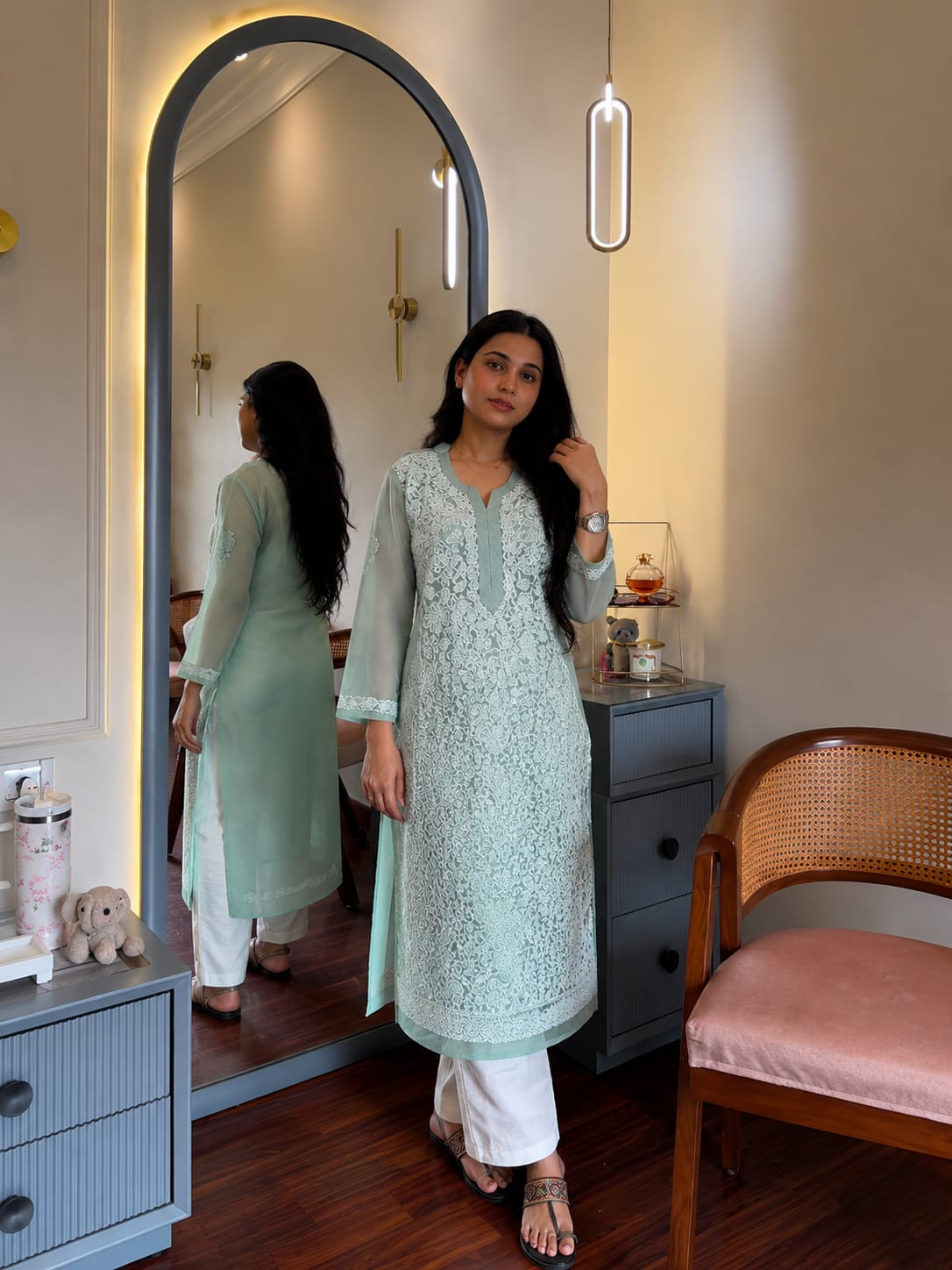 

Karishma Aqua Green Georgette Chikankari Kurti featuring intricate hand embroidery on lightweight georgette fabric for an elegant festive and ethnic look by Hayat’s Lucknowi.
