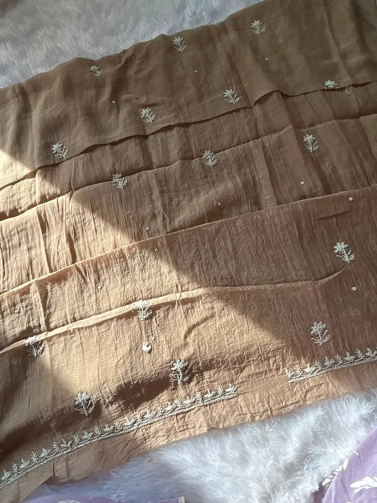 
Khazra women's brown mul Chanderi handwork kurta and dupatta unstitched suit featuring intricate handcrafted detailing and elegant traditional craftsmanship for timeless ethnic wear by Hayat's Lucknowi.
