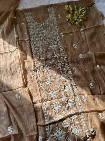 
Khazra women's brown mul Chanderi handwork kurta and dupatta unstitched suit featuring intricate handcrafted detailing and elegant traditional craftsmanship for timeless ethnic wear by Hayat's Lucknowi.
