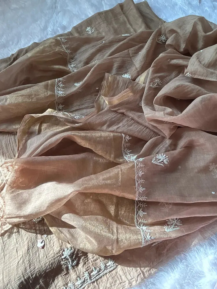 
Khazra women's brown mul Chanderi handwork kurta and dupatta unstitched suit featuring intricate handcrafted detailing and elegant traditional craftsmanship for timeless ethnic wear by Hayat's Lucknowi.
