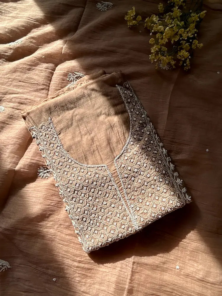 
Khazra women's brown mul Chanderi handwork kurta and dupatta unstitched suit featuring intricate handcrafted detailing and elegant traditional craftsmanship for timeless ethnic wear by Hayat's Lucknowi.
