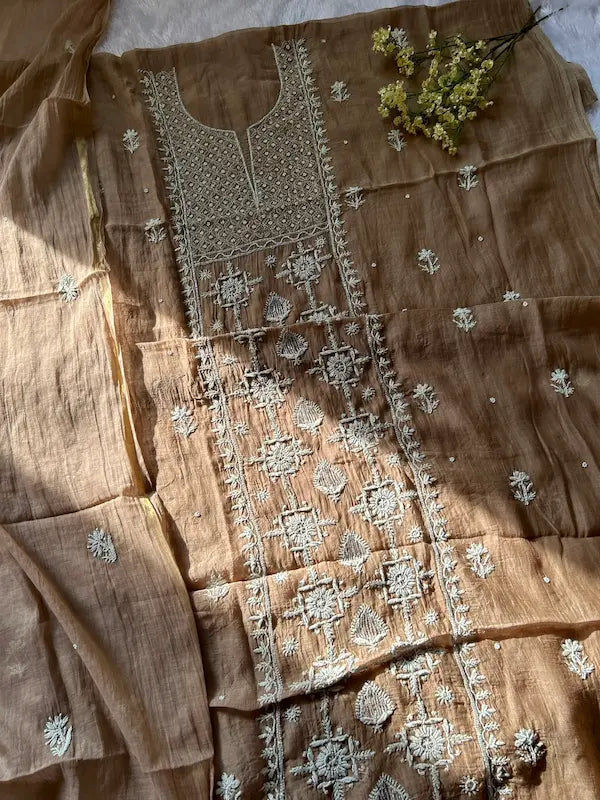 
Khazra women's brown mul Chanderi handwork kurta and dupatta unstitched suit featuring intricate handcrafted detailing and elegant traditional craftsmanship for timeless ethnic wear by Hayat's Lucknowi.
