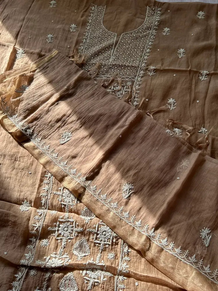 
Khazra women's brown mul Chanderi handwork kurta and dupatta unstitched suit featuring intricate handcrafted detailing and elegant traditional craftsmanship for timeless ethnic wear by Hayat's Lucknowi.
