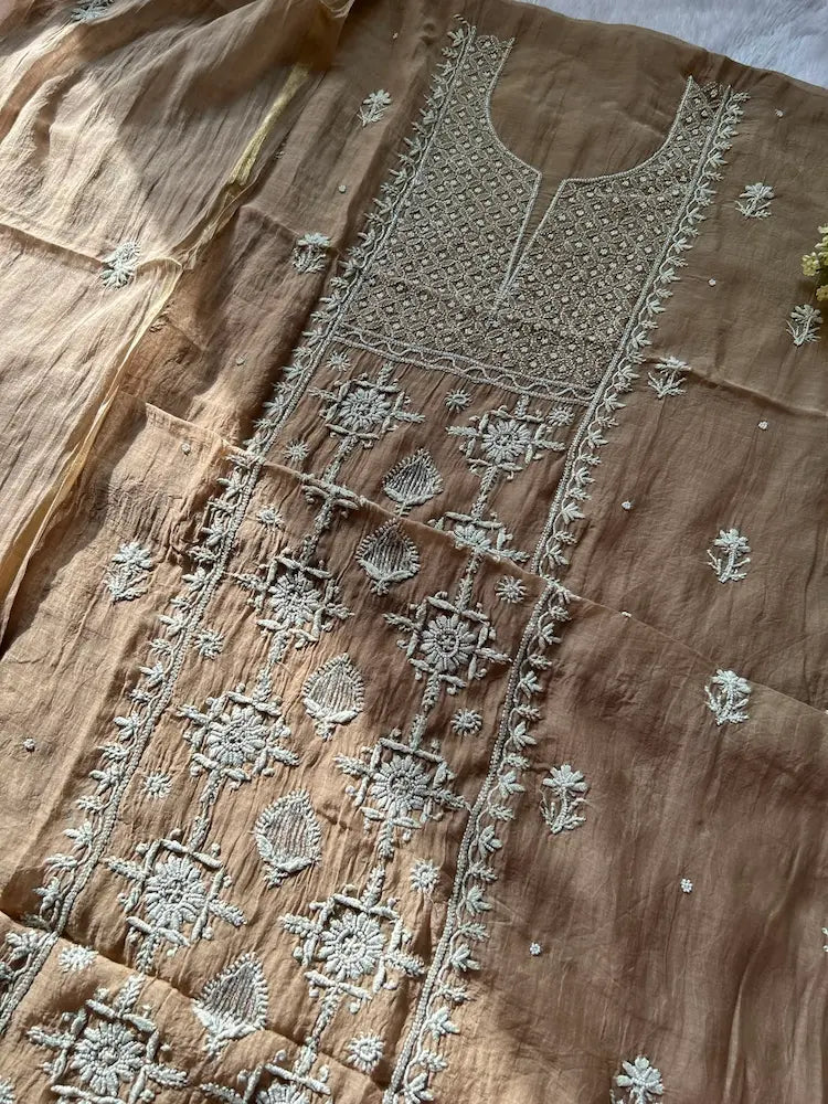 
Khazra women's brown mul Chanderi handwork kurta and dupatta unstitched suit featuring intricate handcrafted detailing and elegant traditional craftsmanship for timeless ethnic wear by Hayat's Lucknowi.
