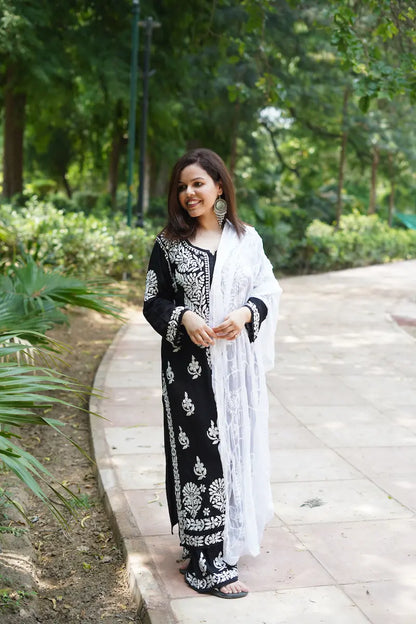 Black rayon kurta set with chikankari embroidery by Hayat’s Lucknowi