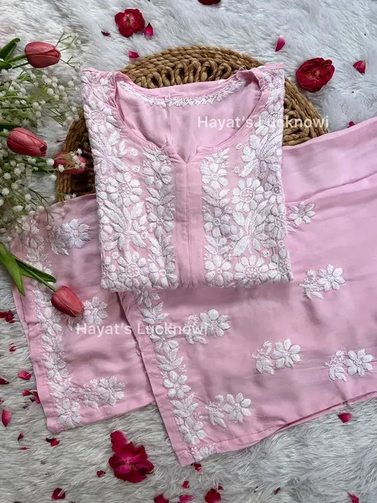 
Khushi pink Lucknowi chikankari rayon kurta set featuring delicate hand embroidery and elegant traditional craftsmanship for graceful festive and everyday ethnic wear by Hayat's Lucknowi.
