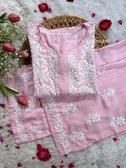 
Khushi pink Lucknowi chikankari rayon kurta set featuring delicate hand embroidery and elegant traditional craftsmanship for graceful festive and everyday ethnic wear by Hayat's Lucknowi.
