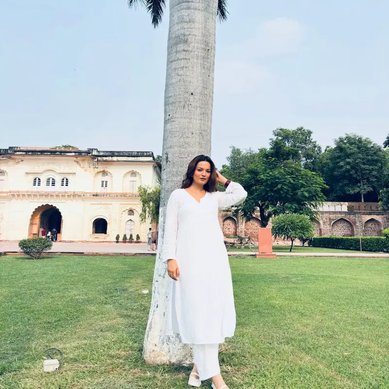 Khushi white rayon Lucknowi Chikankari kurta set featuring intricate handcrafted white Chikankari embroidery on soft, breathable rayon fabric for elegant everyday and festive ethnic wear by Hayat's Lucknowi.
