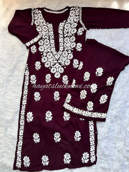 
Khushi wine rayon Lucknowi chikankari kurta set featuring delicate hand embroidery and elegant traditional craftsmanship for rich, graceful festive and ethnic wear by Hayat's Lucknowi.
