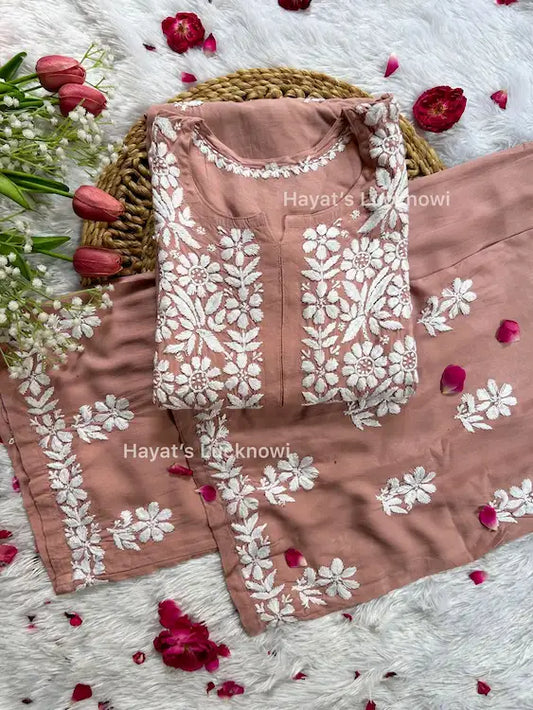 
Khushi nude pink rayon Lucknowi chikankari kurta set featuring delicate hand embroidery and elegant traditional craftsmanship for soft, graceful ethnic wear by Hayat's Lucknowi.
